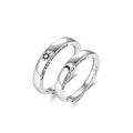 A pair of sterling silver rings, one with a sun design and the other with a moon design, engraved on the inside of the bands.